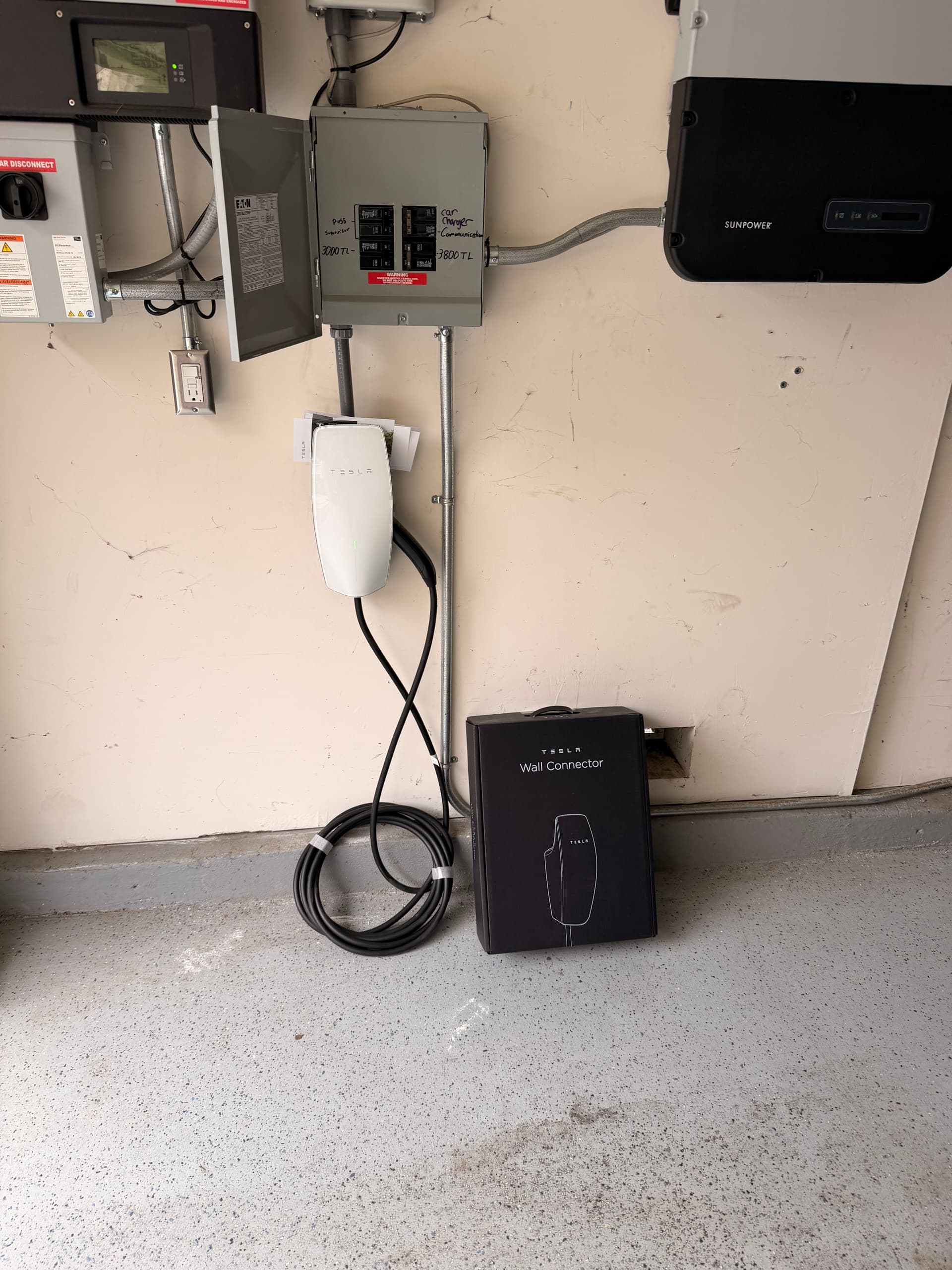 Tesla Wall Connector Installed Right in the Garage image